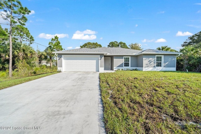 single story home featuring a front yard and a garage