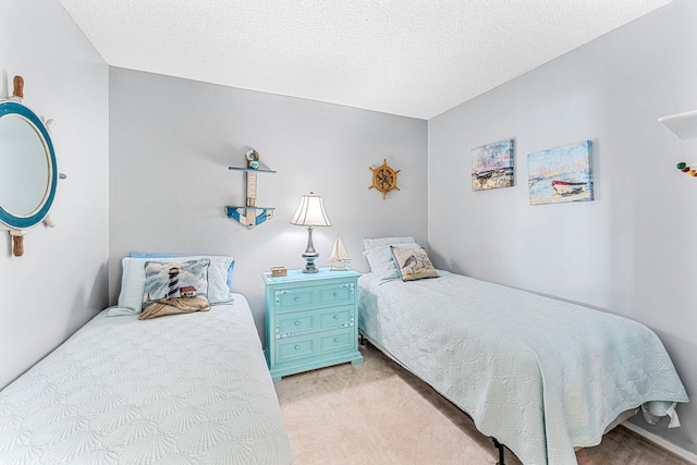 carpeted bedroom with a textured ceiling