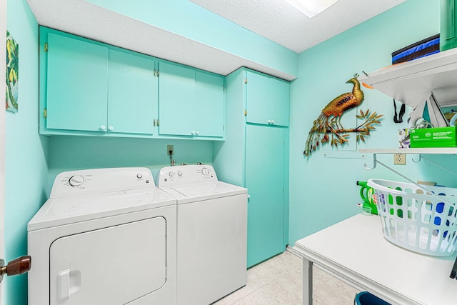 washroom with independent washer and dryer, a textured ceiling, light tile flooring, and cabinets