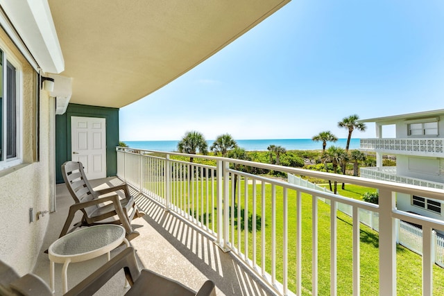 balcony featuring a water view