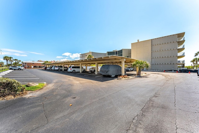 view of vehicle parking with a carport