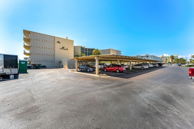 view of vehicle parking featuring a carport