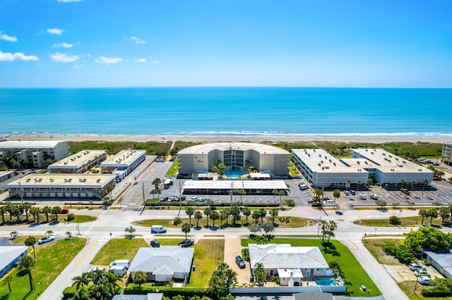 birds eye view of property with a view of the beach and a water view