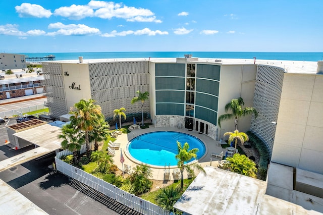 view of swimming pool with a water view