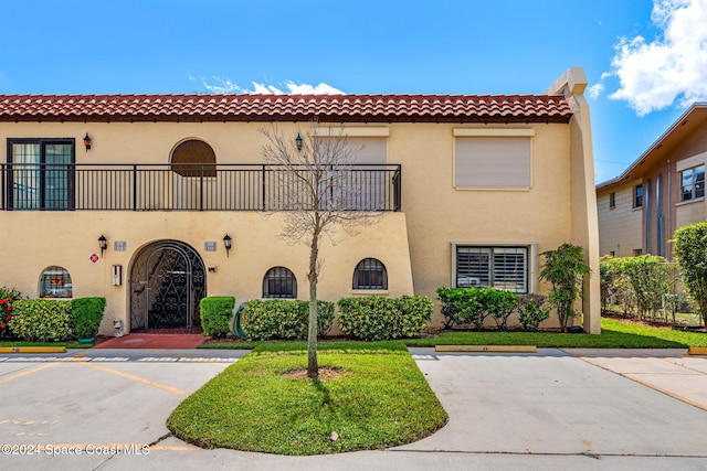 view of front of property with a balcony