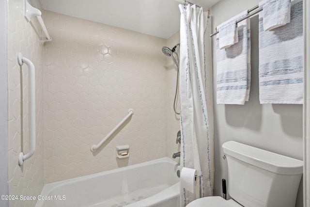 bathroom with toilet and shower / bathtub combination with curtain