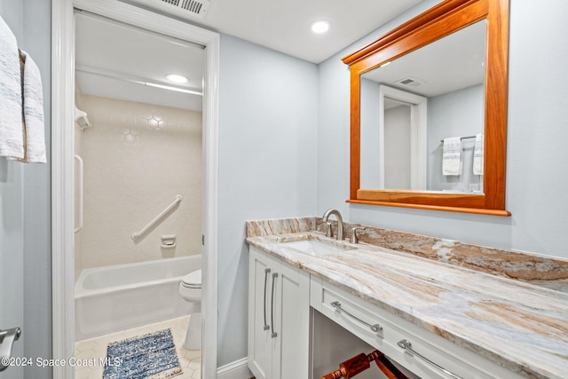 bathroom with vanity, toilet, and tile patterned floors