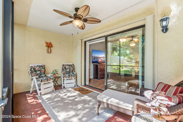 sunroom / solarium with ceiling fan