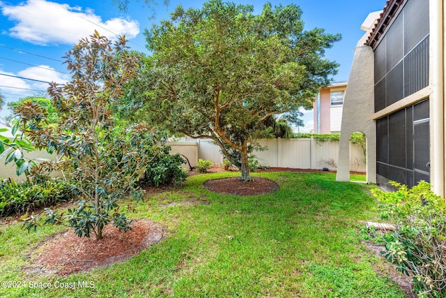 view of yard featuring a sunroom