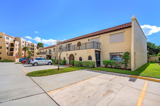 115 N Indian River Dr Unit 133, Cocoa, FL 32922 - view of building exterior with uncovered parking