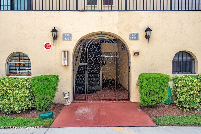 115 N Indian River Dr Unit 133, Cocoa, FL 32922 - doorway to property with stucco siding