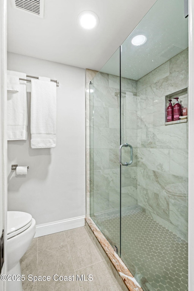 115 N Indian River Dr Unit 133, Cocoa, FL 32922 - full bath with baseboards, a shower stall, toilet, tile patterned flooring, and recessed lighting