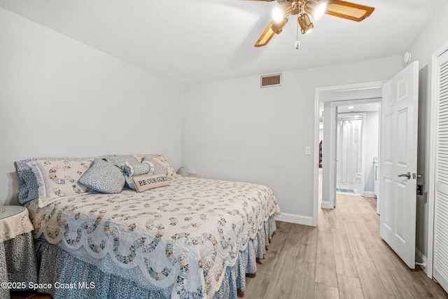 115 N Indian River Dr Unit 133, Cocoa, FL 32922 - bedroom with light wood finished floors, baseboards, a closet, and a ceiling fan