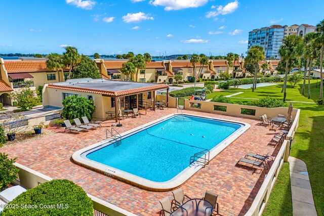 115 N Indian River Dr Unit 133, Cocoa, FL 32922 - community pool featuring a patio area and a residential view