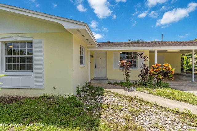 view of front of property with a carport