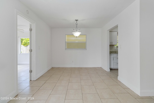 unfurnished room with light tile patterned floors