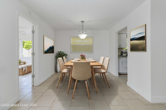 dining space featuring light tile patterned flooring