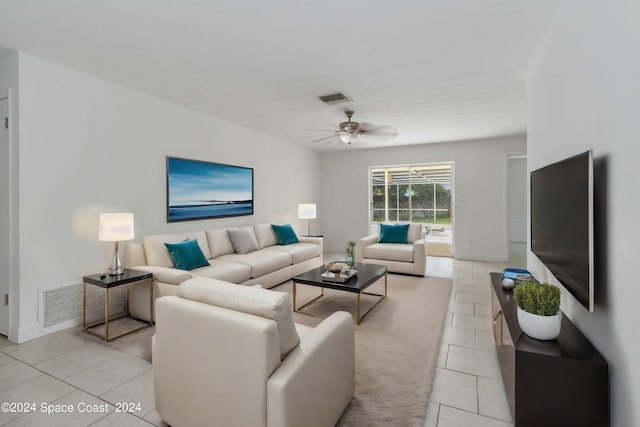 tiled living room featuring ceiling fan