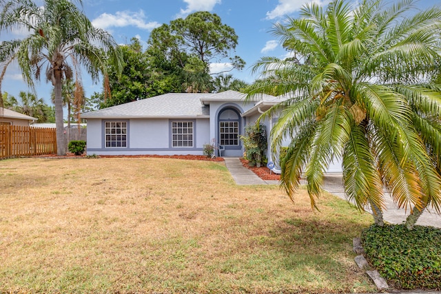 rear view of property with a yard