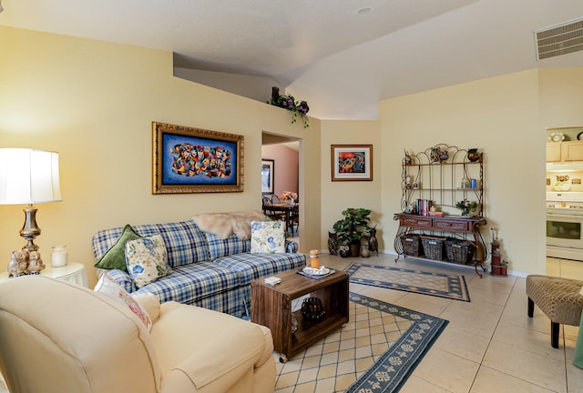 tiled living room featuring vaulted ceiling