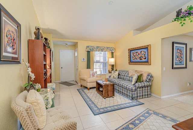 living room with vaulted ceiling and light tile floors