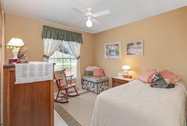 carpeted bedroom with ceiling fan