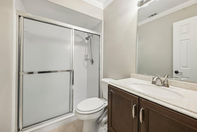 bathroom with toilet, tile floors, ornamental molding, a shower with door, and vanity