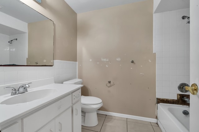 full bathroom with oversized vanity, tile walls, tiled shower / bath, tile floors, and toilet