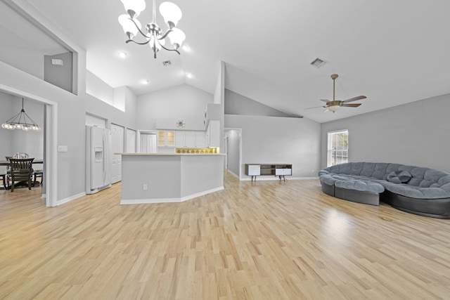 living room featuring high vaulted ceiling, light hardwood / wood-style floors, and ceiling fan with notable chandelier