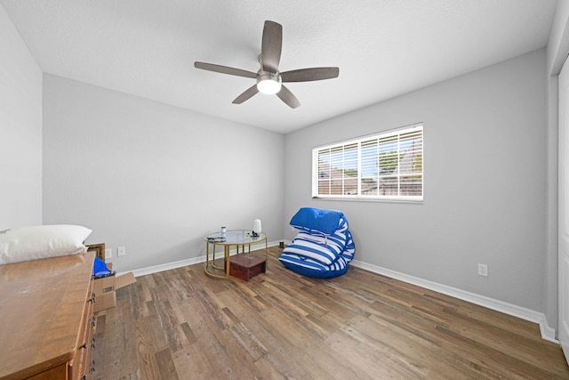 unfurnished room with ceiling fan and hardwood / wood-style flooring