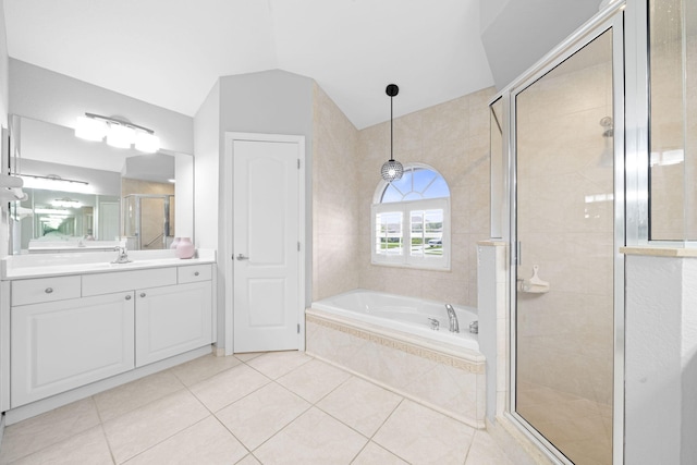 bathroom with large vanity, tile flooring, and separate shower and tub