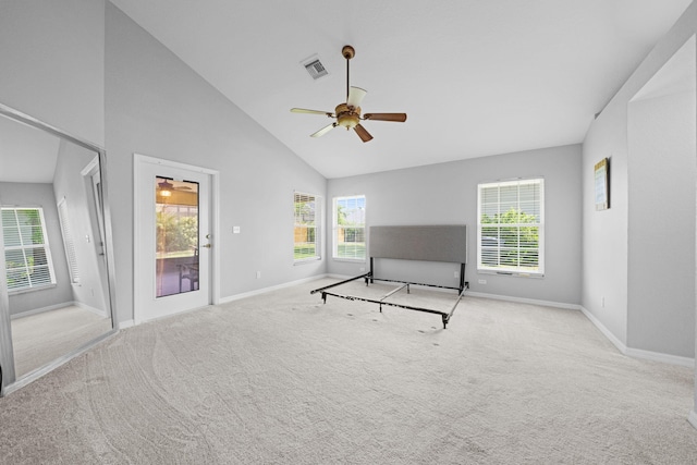 interior space with light colored carpet, high vaulted ceiling, and ceiling fan