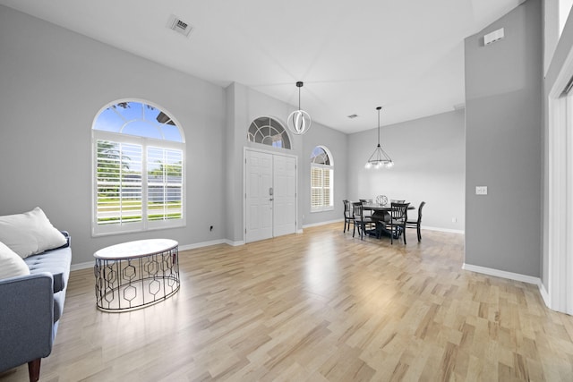 sitting room featuring light hardwood / wood-style flooring and a chandelier