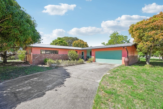 ranch-style house with a garage and a front yard