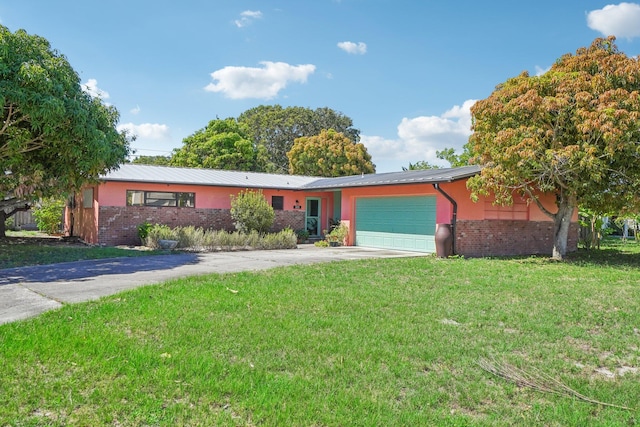 ranch-style house featuring a garage and a front yard