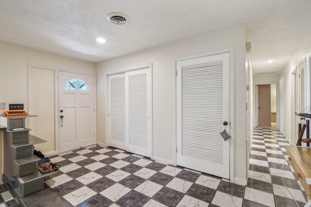 view of tiled foyer