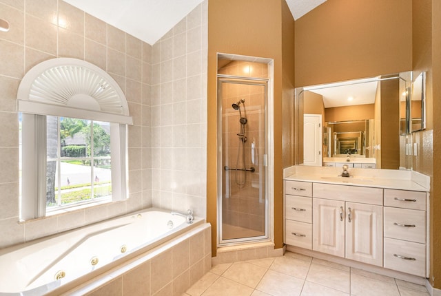 bathroom with tile patterned flooring, vanity, lofted ceiling, and shower with separate bathtub