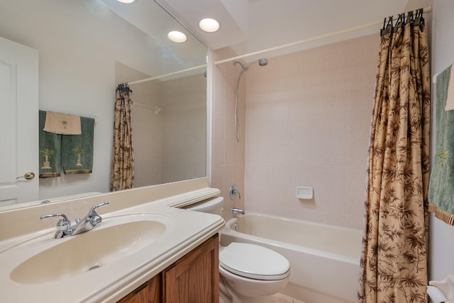 full bathroom featuring vanity, toilet, and shower / bath combo with shower curtain