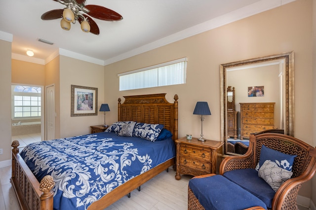 bedroom featuring ensuite bathroom, ornamental molding, ceiling fan, light hardwood / wood-style floors, and a closet