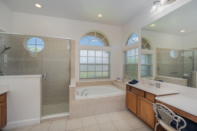 bathroom with vanity, tile patterned floors, a wealth of natural light, and independent shower and bath