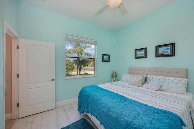 bedroom featuring ceiling fan and light hardwood / wood-style floors