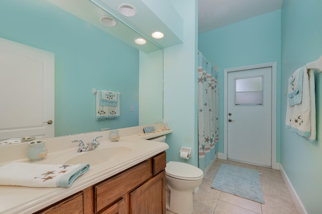 bathroom with a shower with curtain, tile patterned flooring, vanity, and toilet