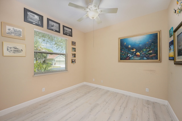 empty room featuring ceiling fan and light wood-type flooring