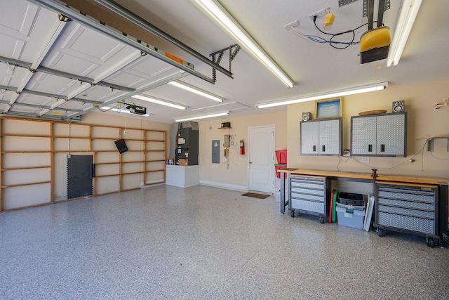 garage with electric panel, heating unit, and a garage door opener