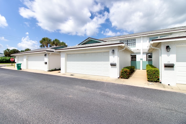 ranch-style home featuring a garage