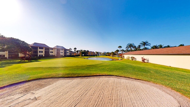 view of property's community with a lawn