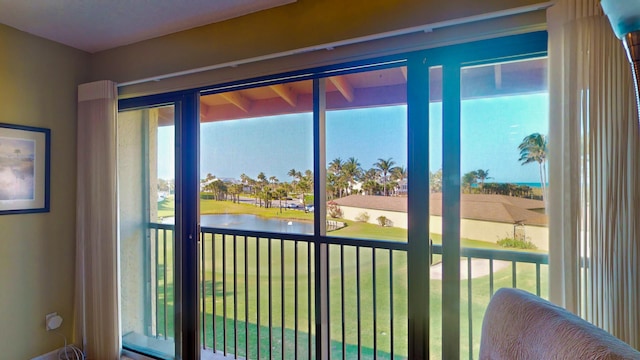 interior space with a water view and plenty of natural light