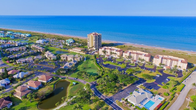 bird's eye view featuring a beach view and a water view