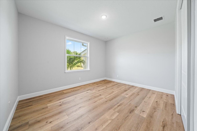 unfurnished room featuring light hardwood / wood-style flooring