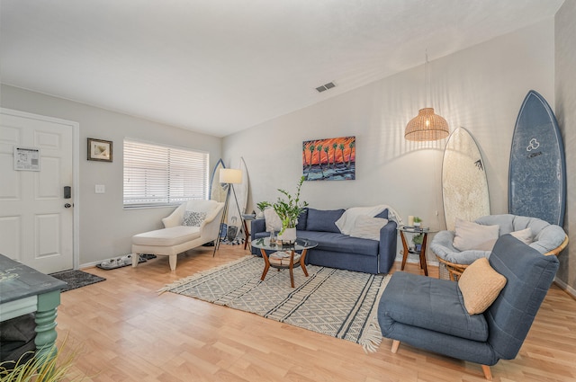 living room with light hardwood / wood-style flooring